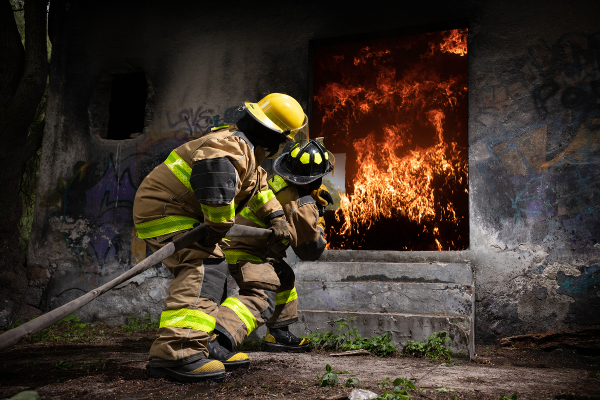 Firefighters putting out fire inside building