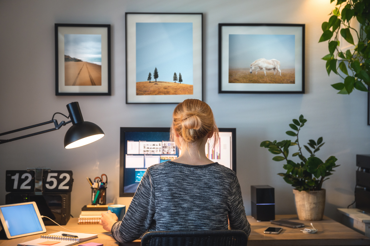 A woman sat at her desk working from home