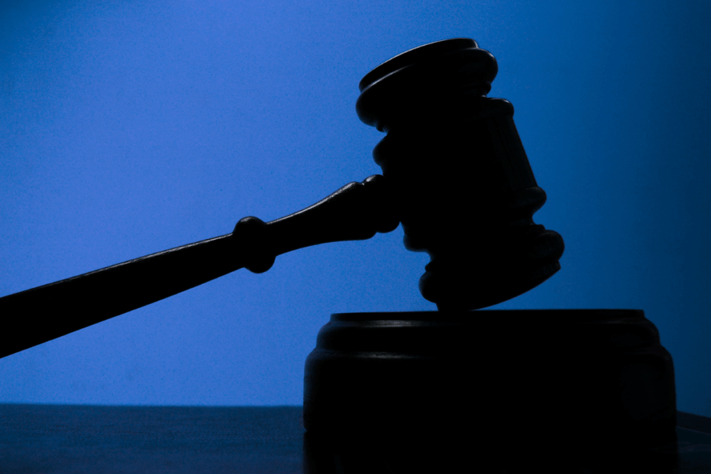 Judges gavel shadow with blue background
