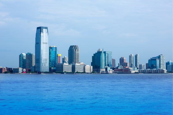 The New Jersey skyline with a blue sky behind it