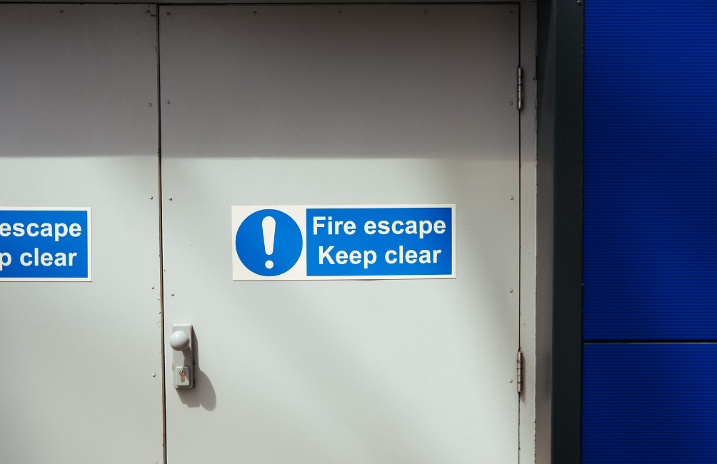 Fire escape keep clear sign on door