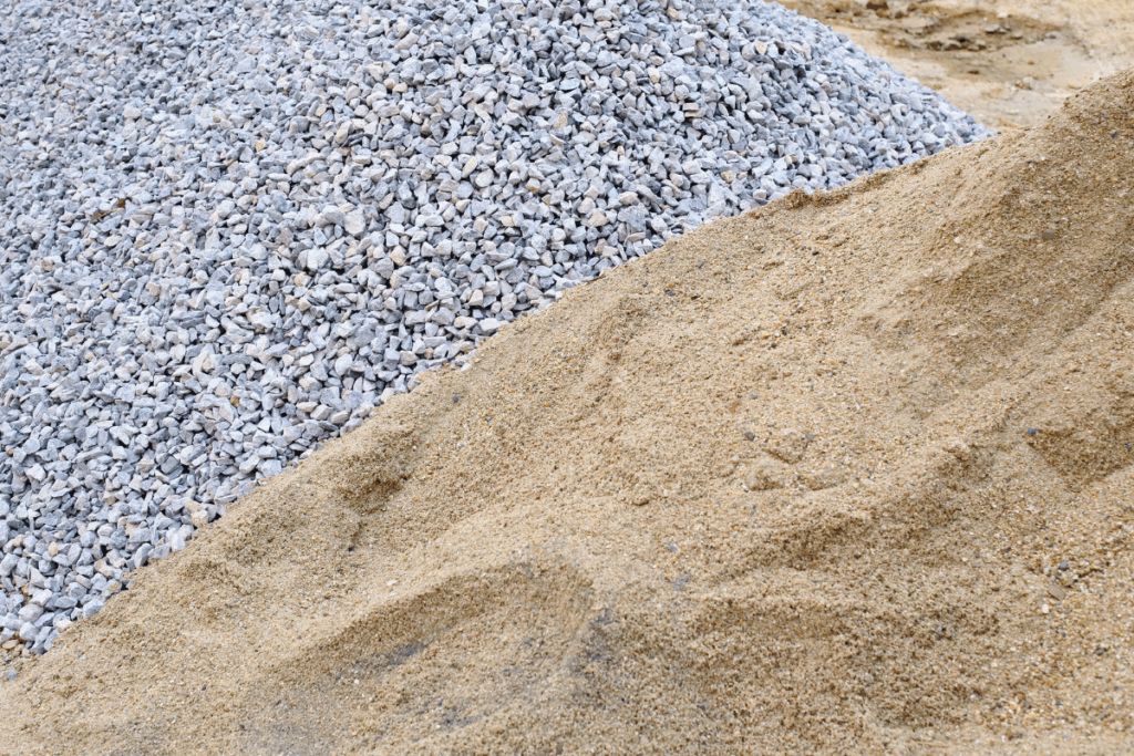 Sand and gravel piles next to one another