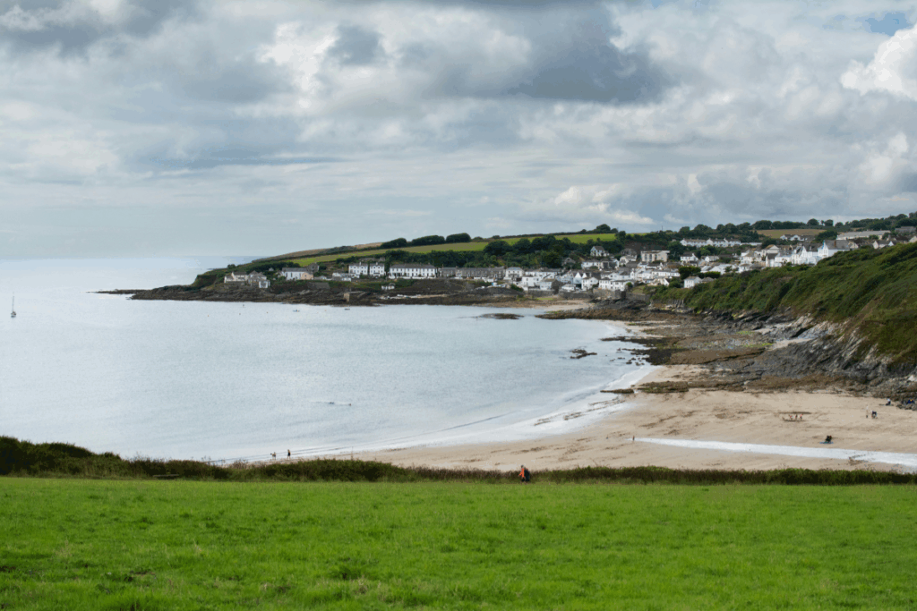 Coastal view of Cornwall, UK, with grey skies and green grass