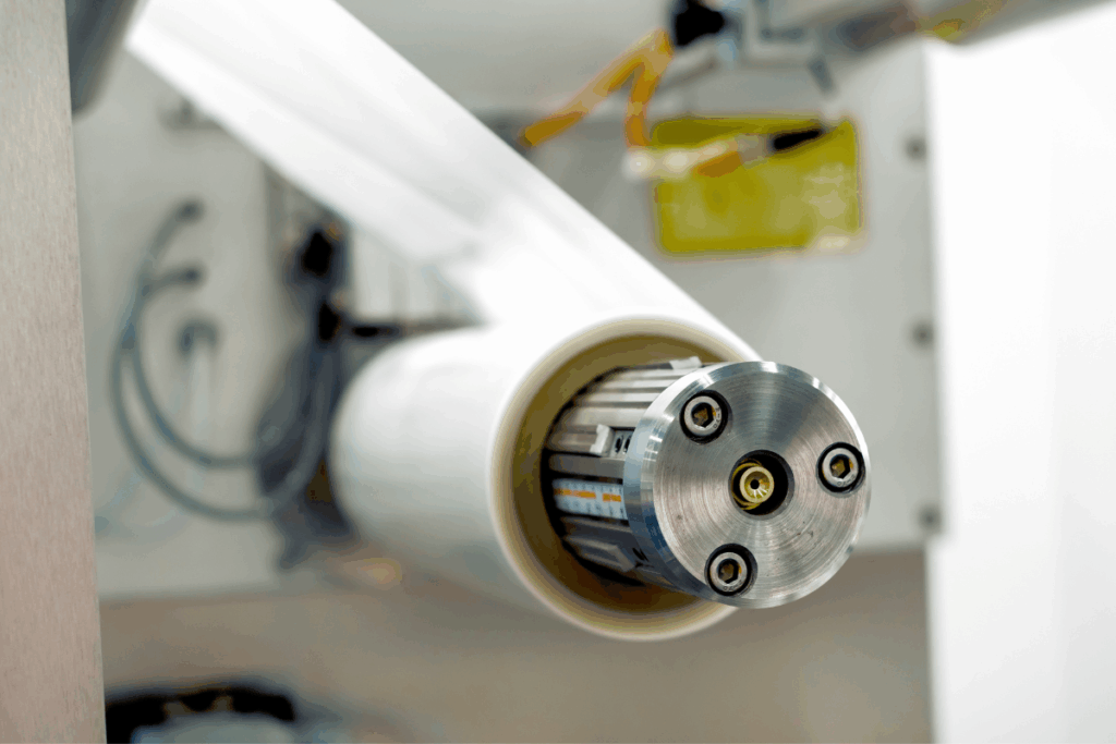 A close-up of a machine with cellulose film packaging