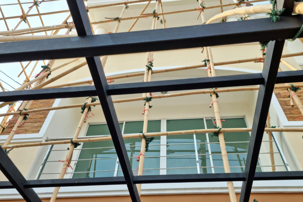 Truss-out bamboo scaffolding on the side of a building