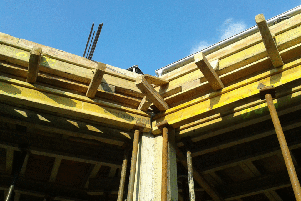Scaffolding and wood on a residential building with blue sky
