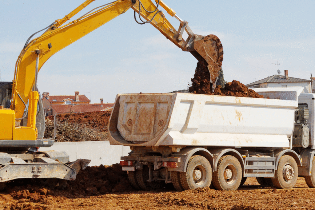 tipper lorry and shovel lorry in use on construction site
