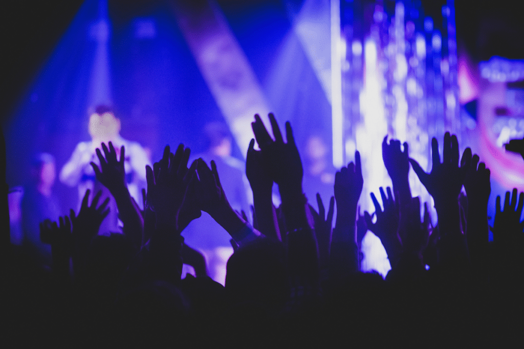 An entertainment venue full of people listening to a performer