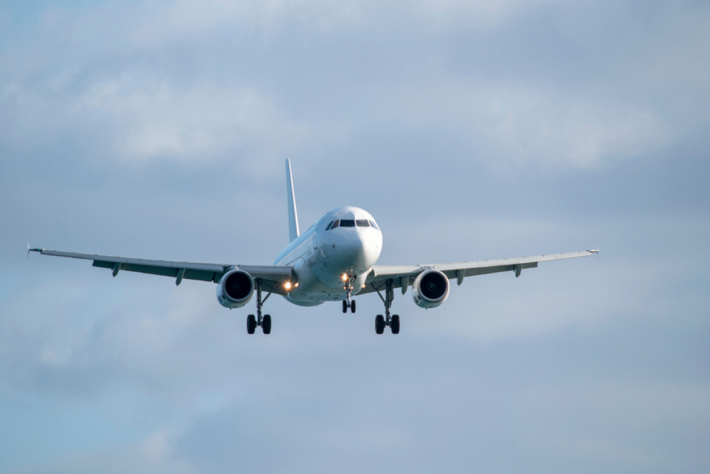 White plane flying in the air