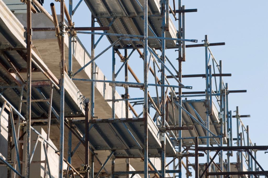 Scaffolding on a building with blue sky behind it
