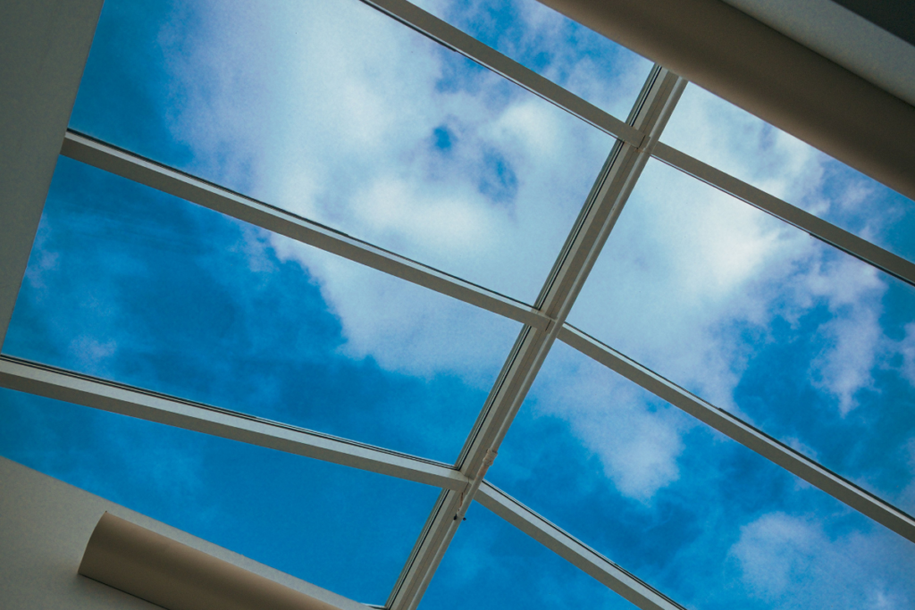 Skylight with blue sky and clouds