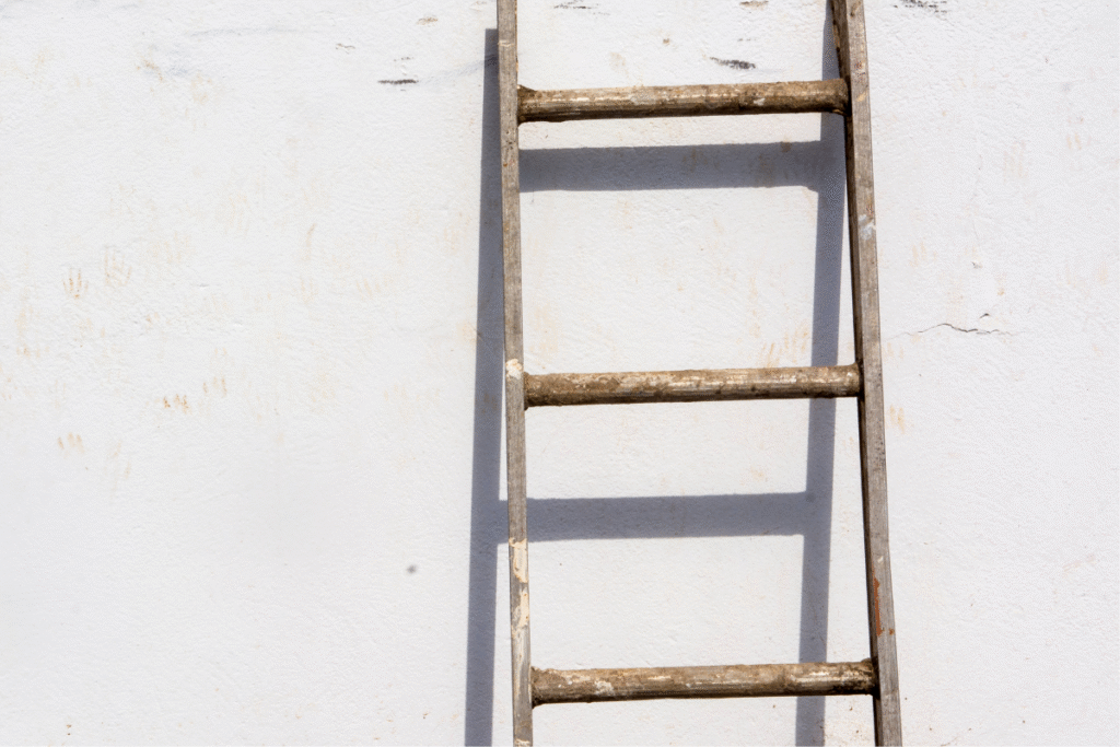 A wooden step ladder on a wall