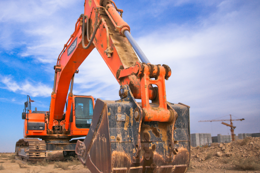 Orange excavator on site