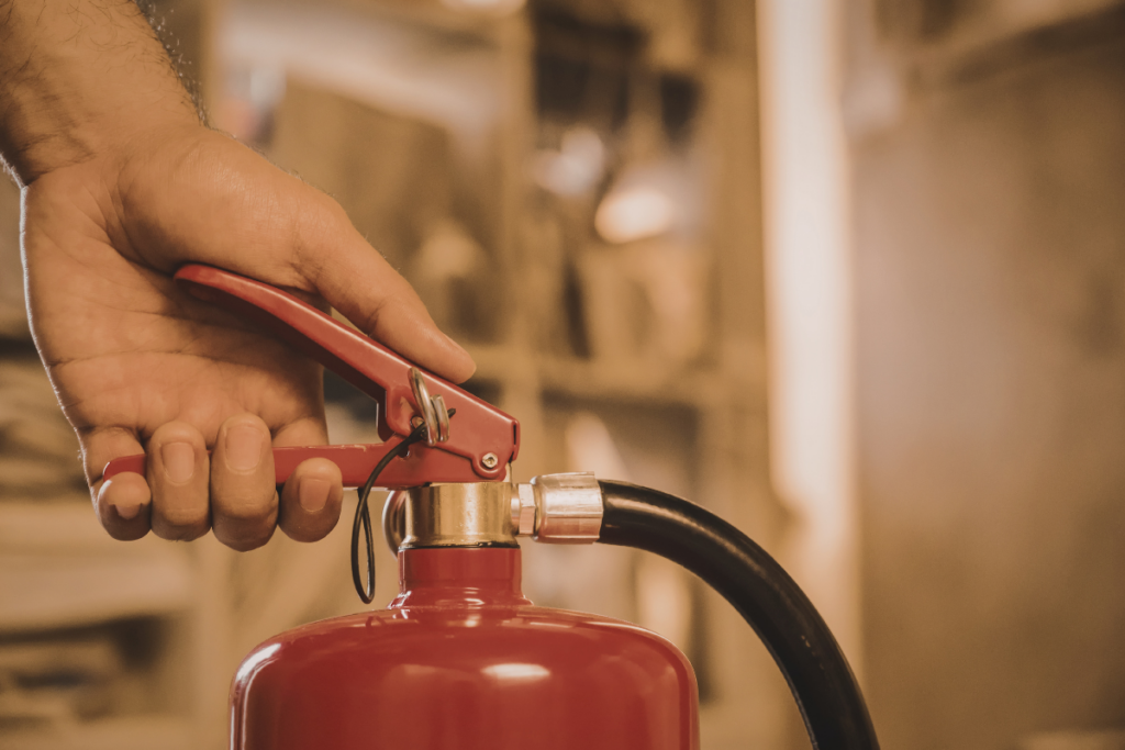 Someone holding a fire extinguisher