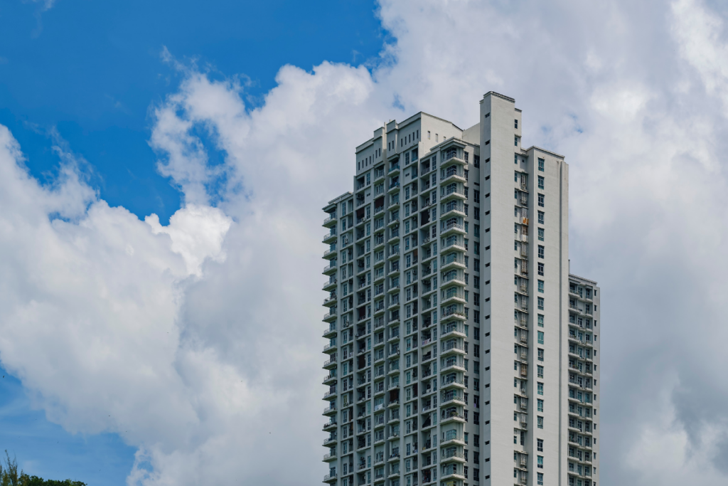 high rise building with clouds and sky